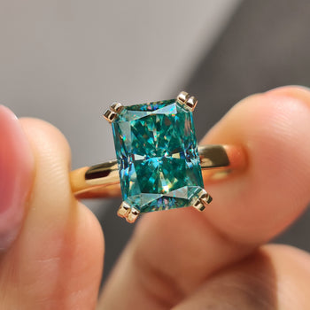 Blue moissanite engagement ring set in a refined design.