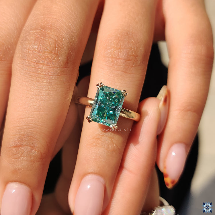 Custom handmade ring with double prong moissanite.