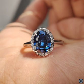 This blue oval engagement ring offers a unique, bold design.