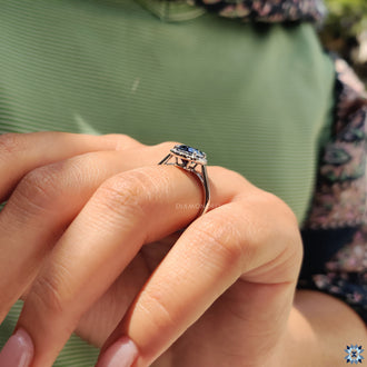 The 4 prong claw setting securely holds the gemstone with elegance.