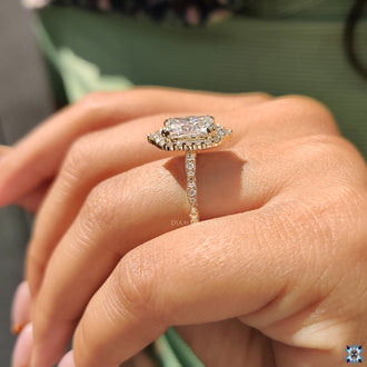 Round cut halo ring with intricate milgrain accents.