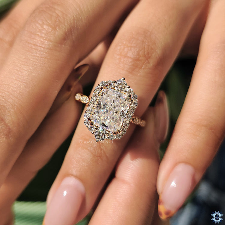 Vintage engagement ring featuring a radiant cut moissanite center.