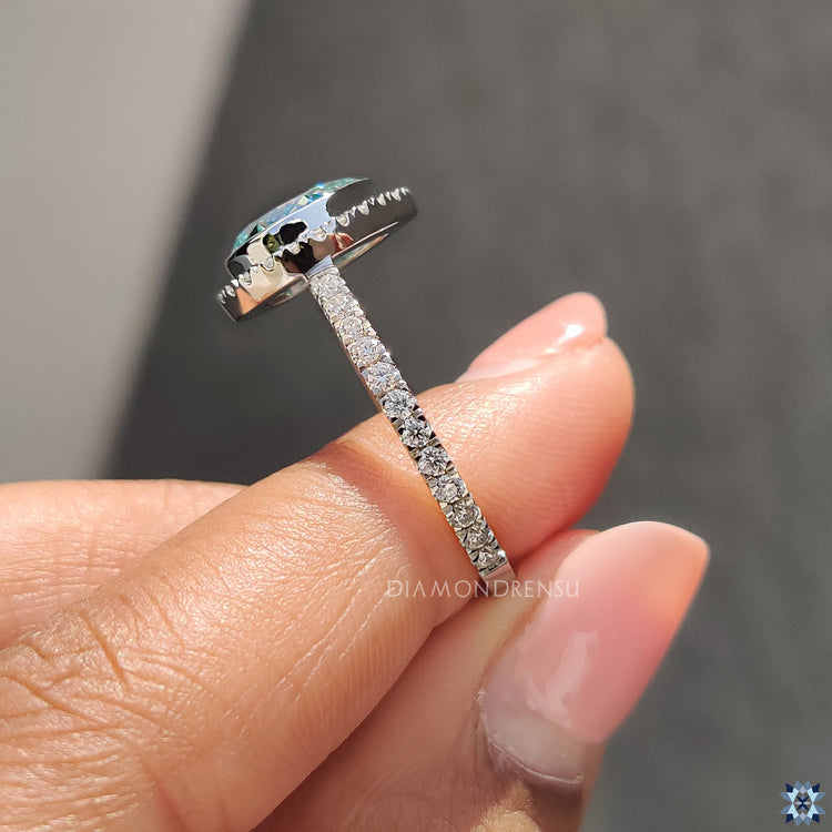 Cyan Blue Moissanite Ring set in a gorgeous white gold ring.