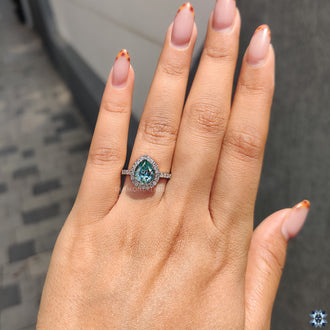 Diamondrensu Ring with a pave ring setting and cyan blue Moissanite.