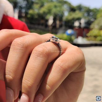 Handmade Ring with a Pear Cut Moissanite in a white gold setting.