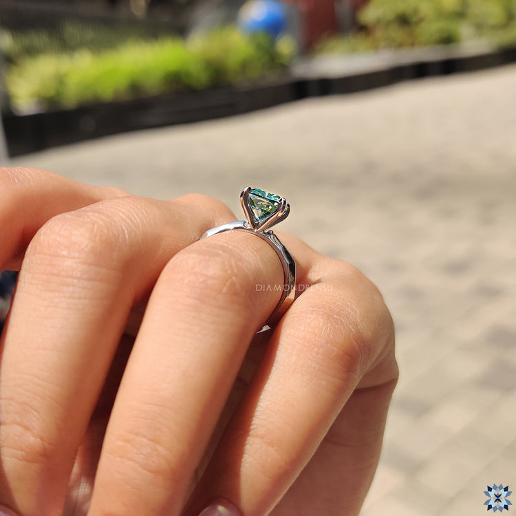 Moissanite engagement ring featuring a cushion cut stone, offering stunning brilliance and eco-friendly beauty.