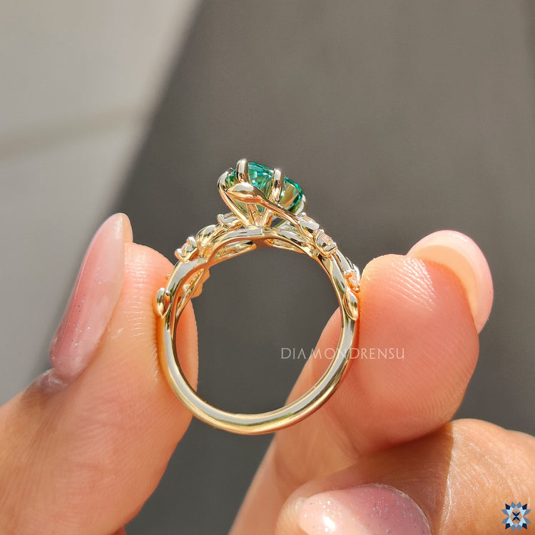 Green pear cut moissanite ring, offering a vibrant and unique color that enhances its brilliance.