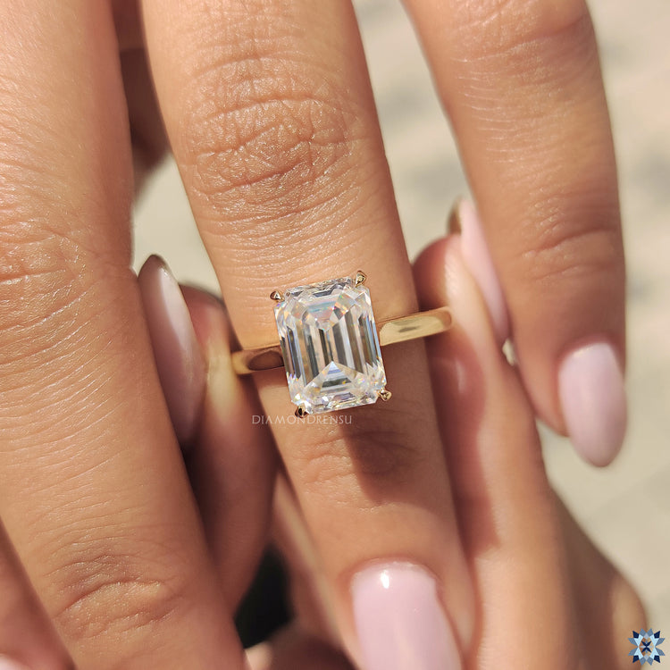 Anniversary gifts for her, including a stunning emerald cut moissanite ring for a special and memorable occasion.