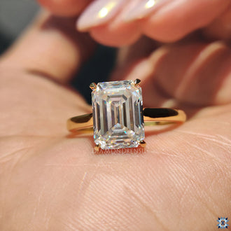 Solitaire emerald cut engagement ring, with a brilliant moissanite center stone for a modern yet classic look.