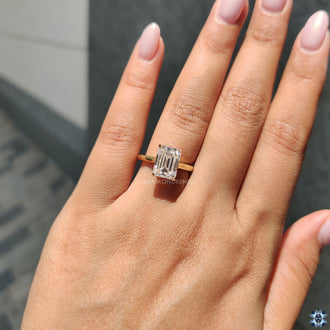 Moissanite engagement ring with an emerald cut stone, offering exceptional clarity and a timeless appeal.