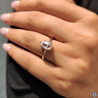 Yellow gold moissanite ring designed as a classic solitaire.