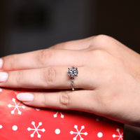 Custom engagement ring featuring a marquise shape outline.