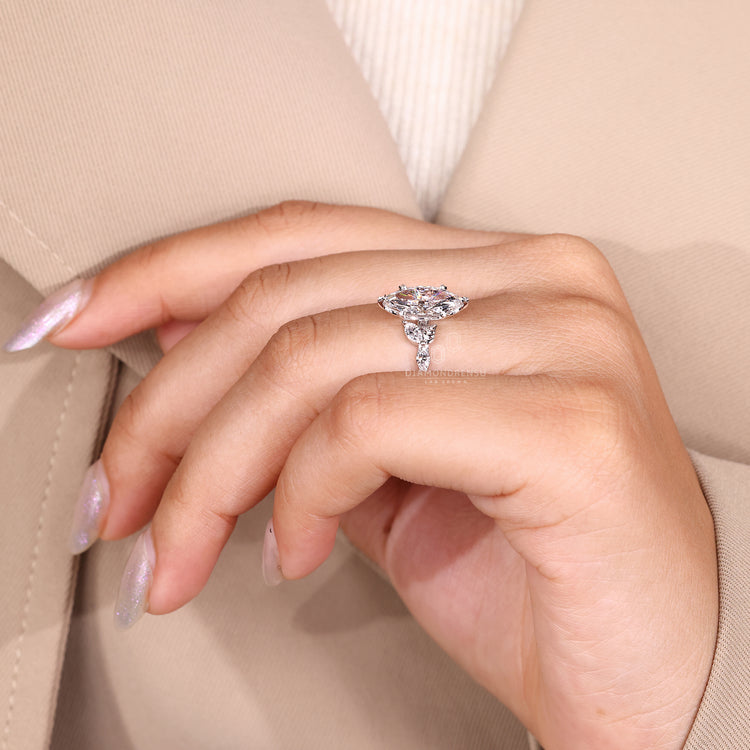 Marquise cut pave band featuring 6 leaf style prong design.