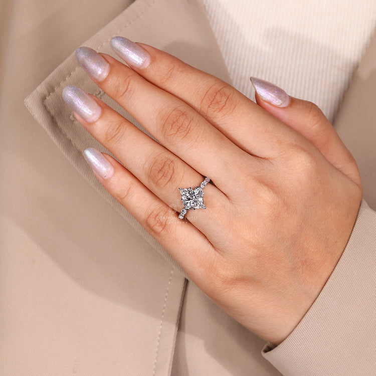 Six leaf style prong ring holding marquise cut diamonds securely.