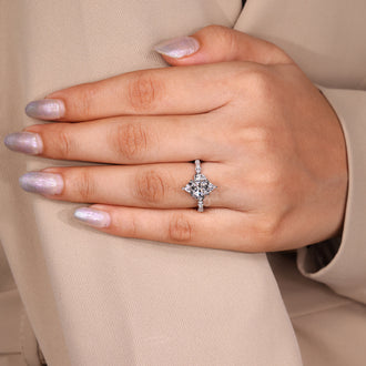 Buy engagement ring with marquise cut diamond in shared prong design.