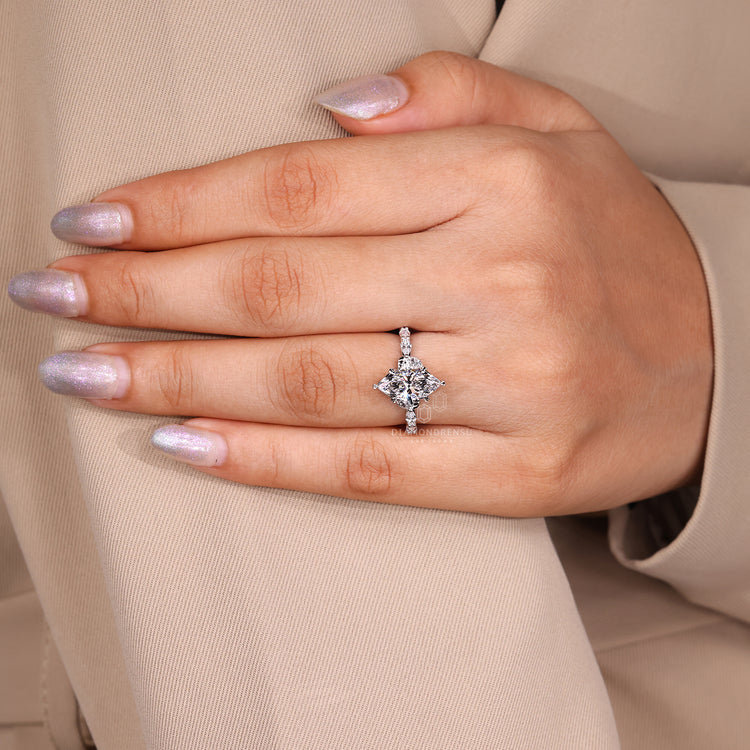 Buy engagement ring with marquise cut diamond in shared prong design.