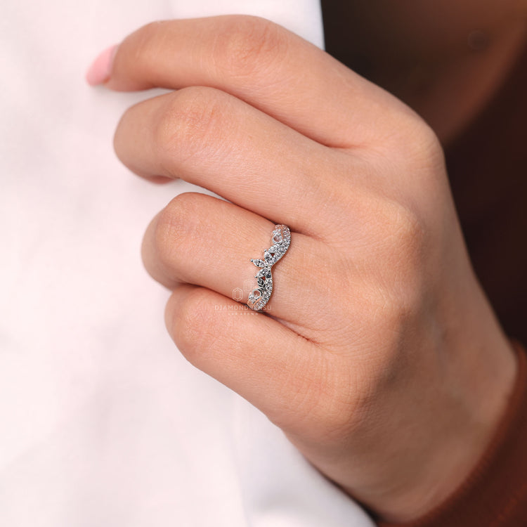 Curvy diamond wedding band with half eternity design in white gold.