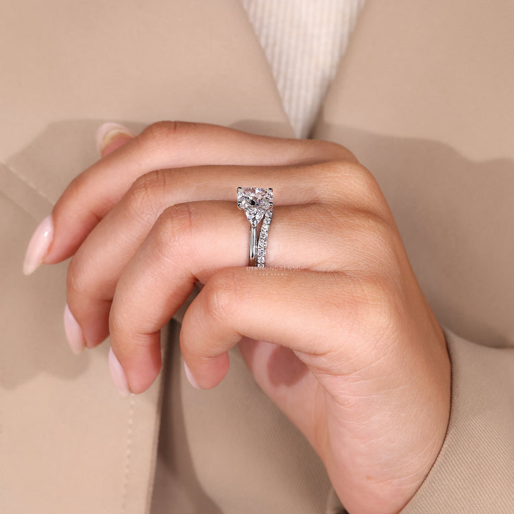 Curved wedding band designed to fit around a cushion cut engagement ring with smooth flow.