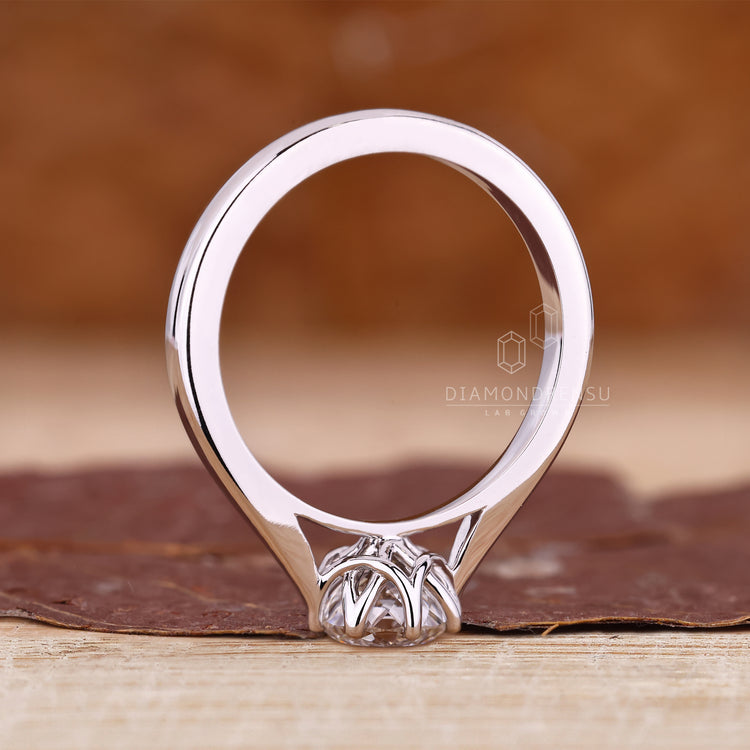 Lab grown diamond solitaire ring set in a polished white gold band.