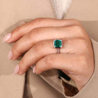 White gold birthstone ring with emerald gemstone.