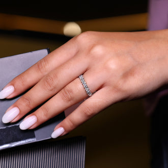 Half eternity diamond band with prong set brilliance.