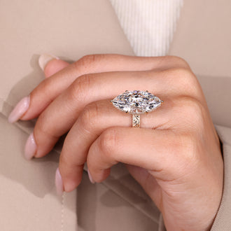 Round diamond hidden halo ring detail.