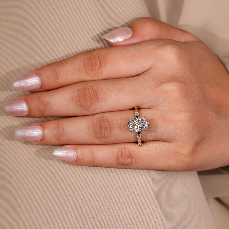 Leaf style prong setting with oval diamond engagement ring