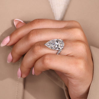 Three claw prong pear diamond ring.
