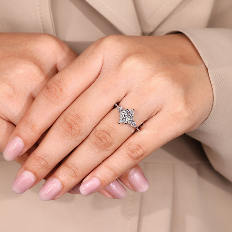 Buy diamond ring with marquise and kite cut side stones.