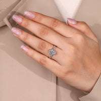 White gold ring with oval cut diamond and six claw prong.