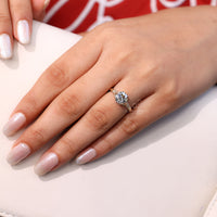 Vintage engagement ring with bridge accent detail.