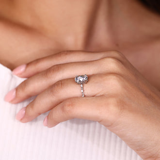 Distance pave setting ring featuring oval rose cut diamond center stone.