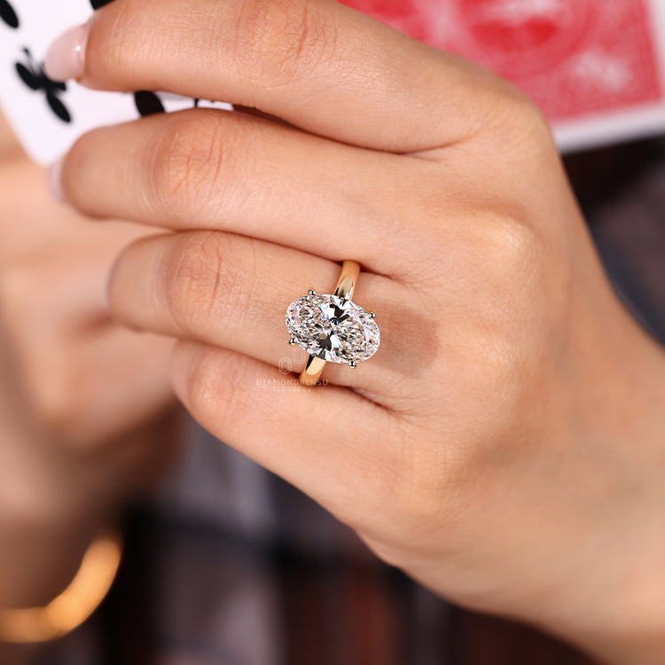 Hidden halo round diamond ring detail.