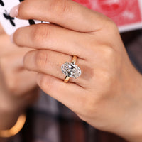 Hidden halo round diamond ring detail.