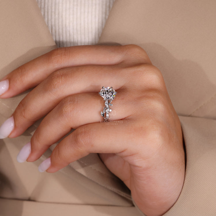 Six leaf style prong ring featuring intricate design.