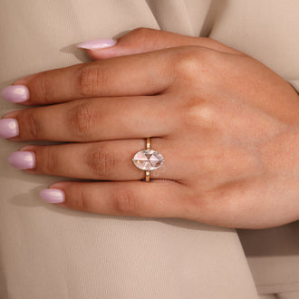 Lab grown diamond ring with oval cut center in solitaire style.