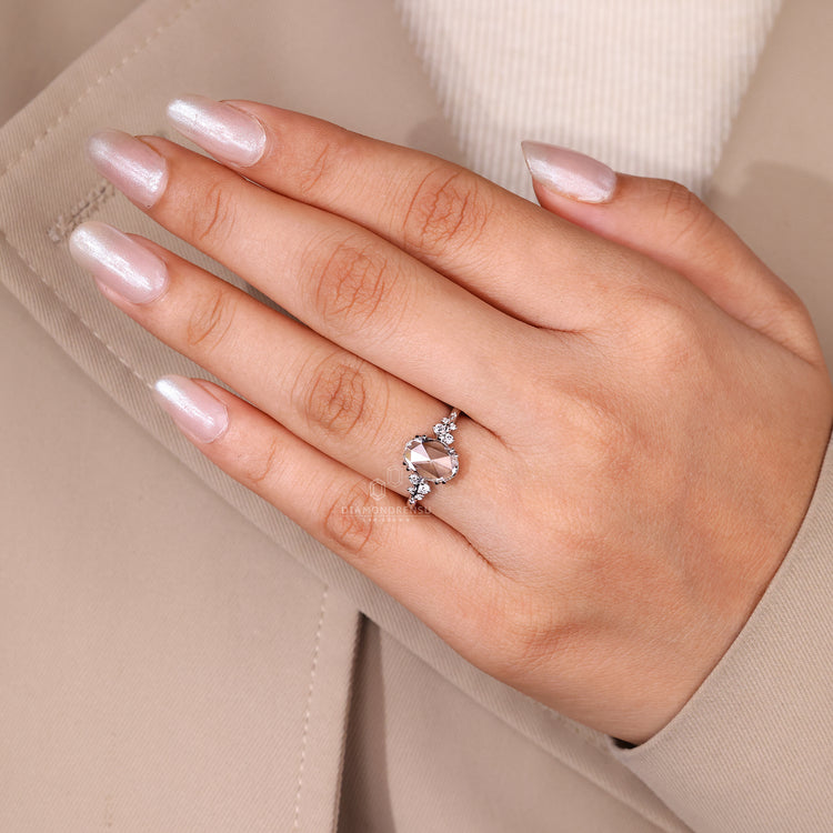 Round side stone ring paired with oval rose cut diamond ring.