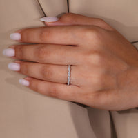 Full eternity wedding band featuring round diamonds and a custom white gold design.