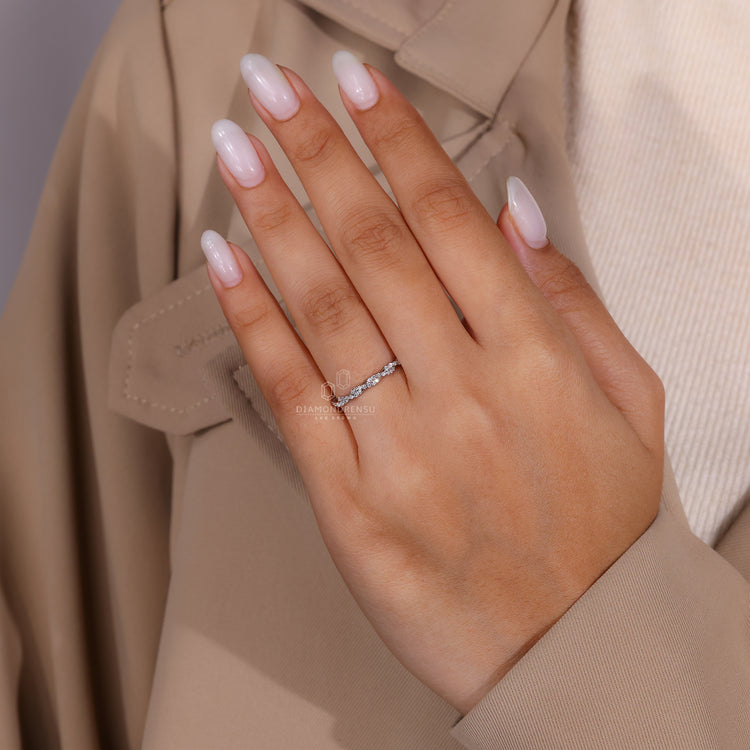 Custom wedding band with round diamonds set in a white gold full eternity design.