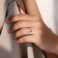 Hidden halo ring with 4 claw prong setting and open gallery.