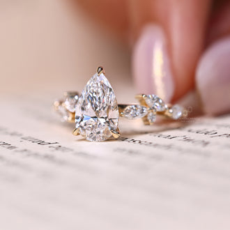 Leaf style ring set with a custom diamond ring center.