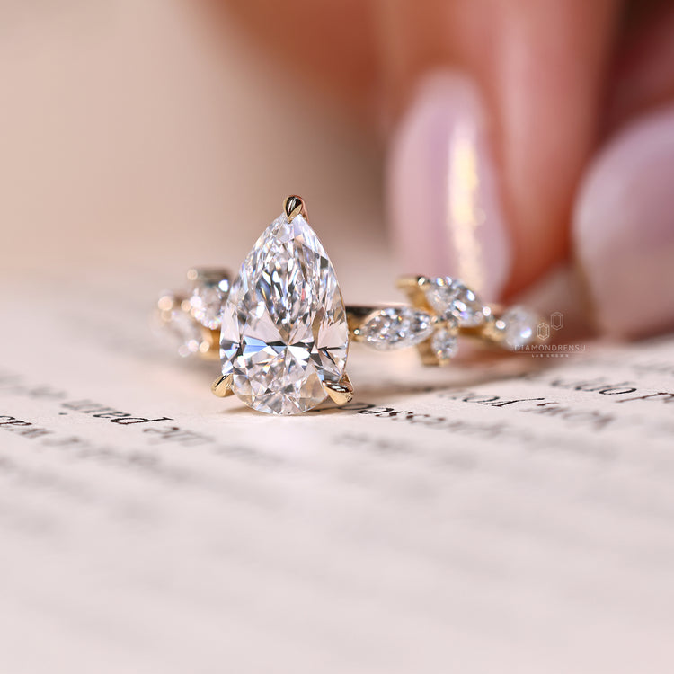 Leaf style ring set with a custom diamond ring center.