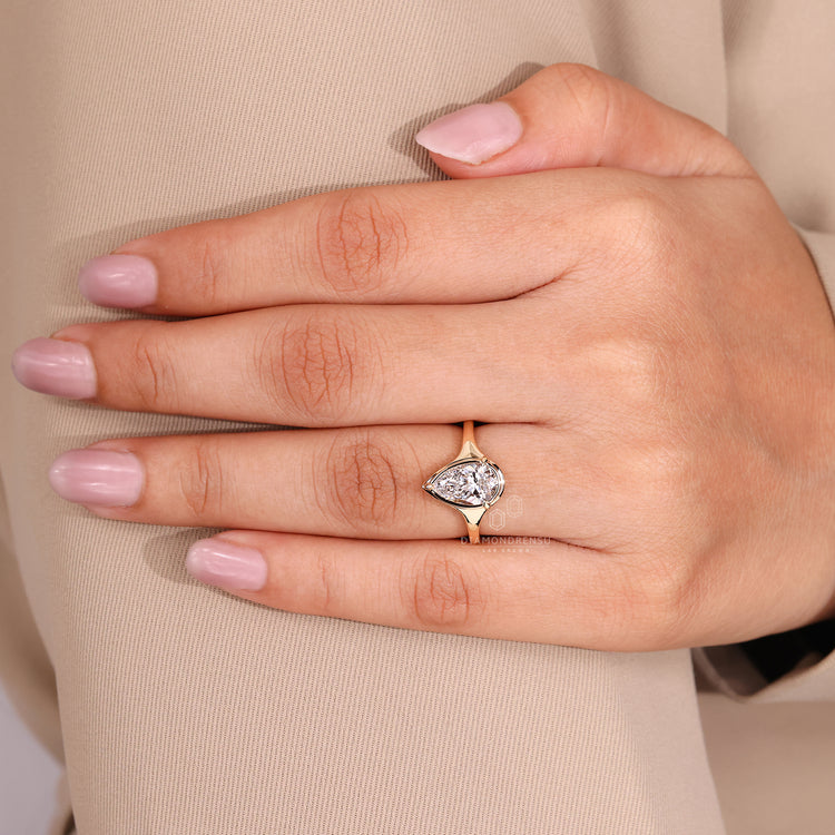 3 Claw Prong Setting ring with solitaire pear diamond.