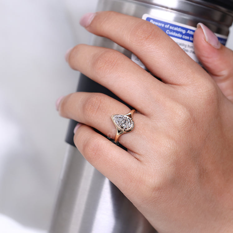 Solitaire Setting Ring with pear cut diamond design.