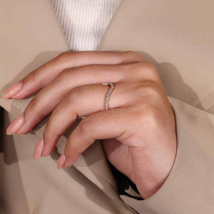 A simple wedding band with a modern wave pattern