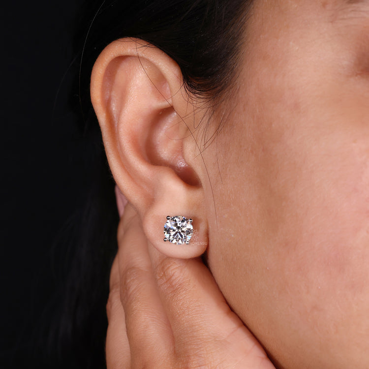 Round diamond earrings with screw on earrings for men and women.