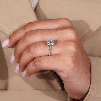 Four prong setting secures the diamond on the white gold ring.