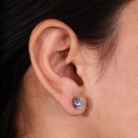 Round stud earrings crafted with IGI certified diamonds for timeless elegance.