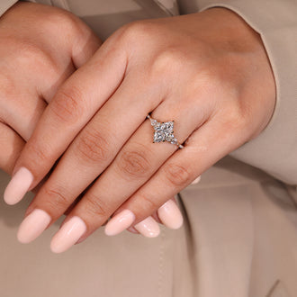 Lab Grown Diamond marquise engagement ring with muse setting and side stones.