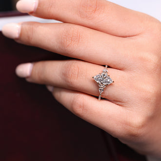 Kite and round side diamond ring paired with marquise engagement diamond.